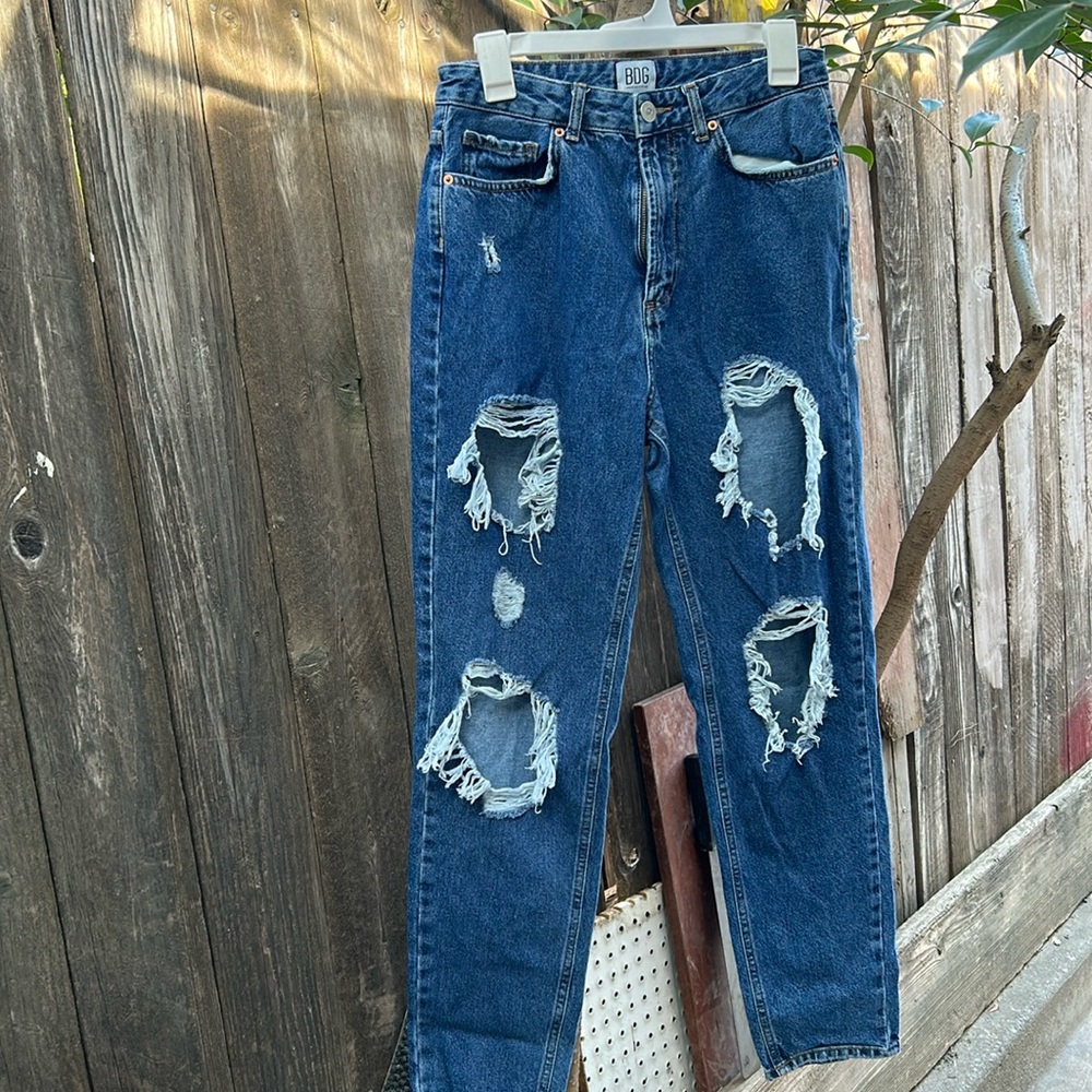 Ripped dark blue jeans